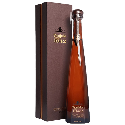 Bottle of Don Julio 1942 rum with a matching box on a white background